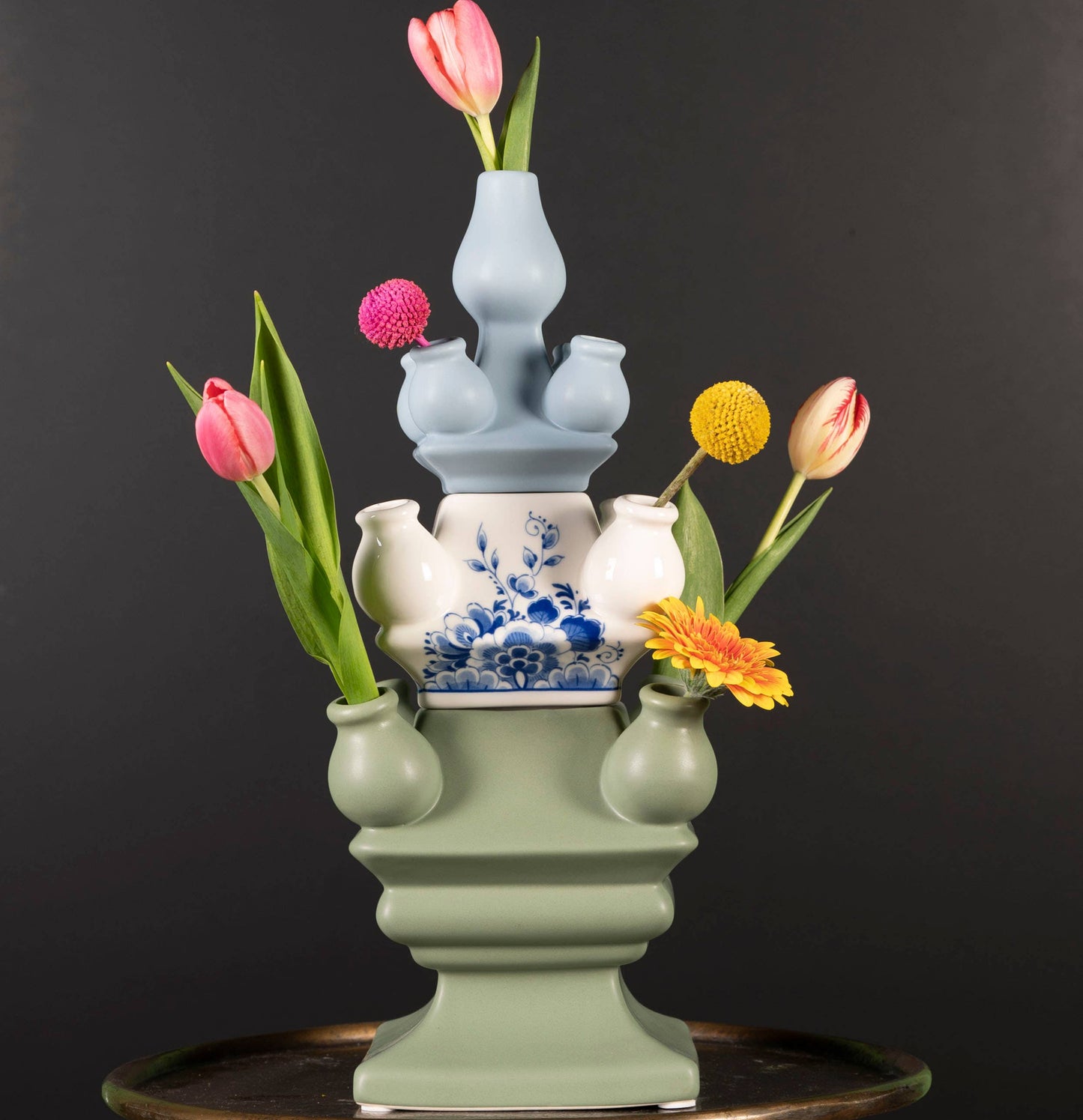 Decorative vase with flowers on a black background