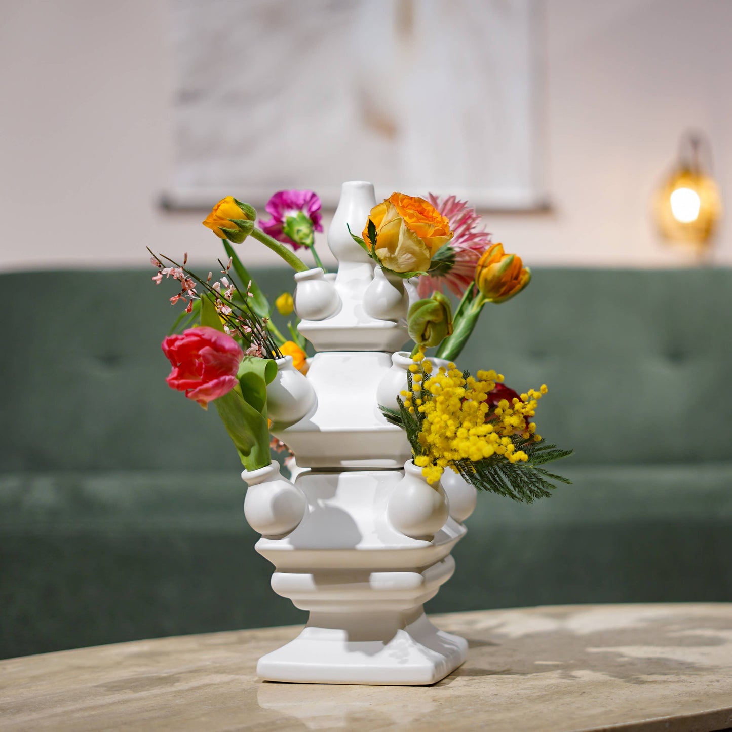 Decorative vase with flowers on a table in a living room setting
